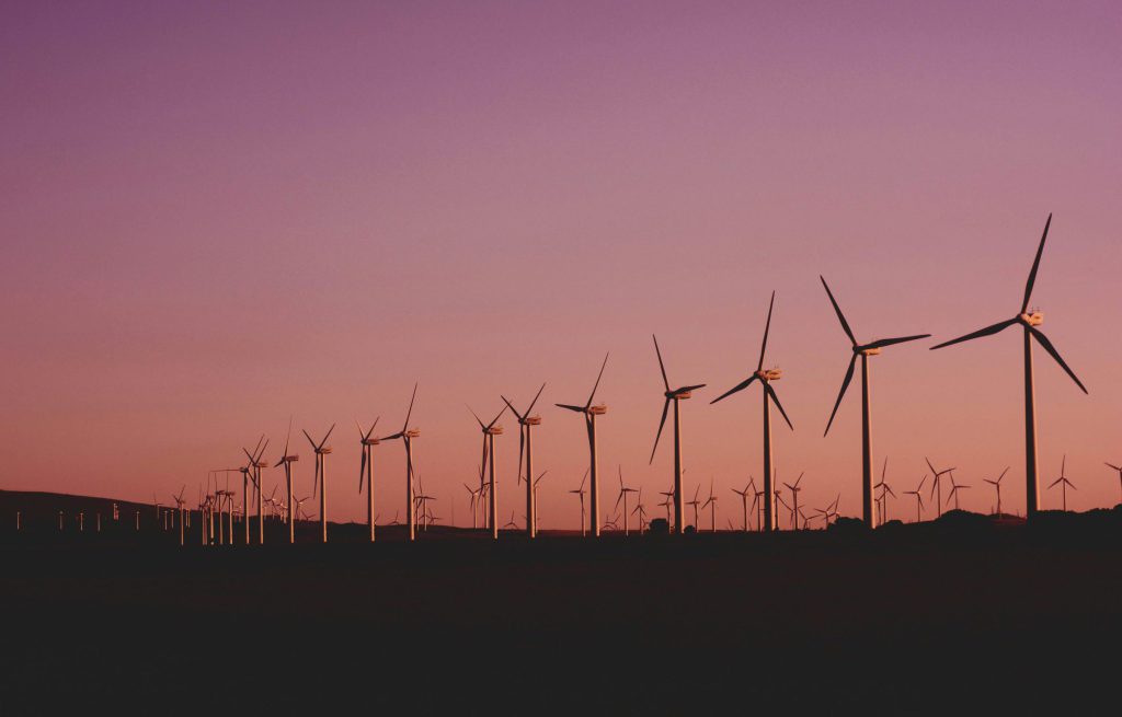 Silhouetted wind turbines at sunset in Zahara de los Atunes, Spain.